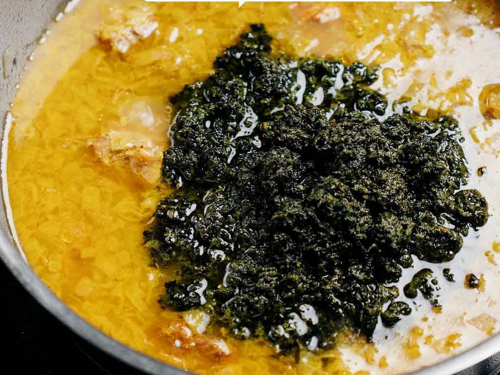 adding spinach to stew