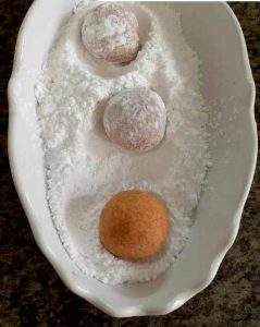 Adding rose water and powdered sugar