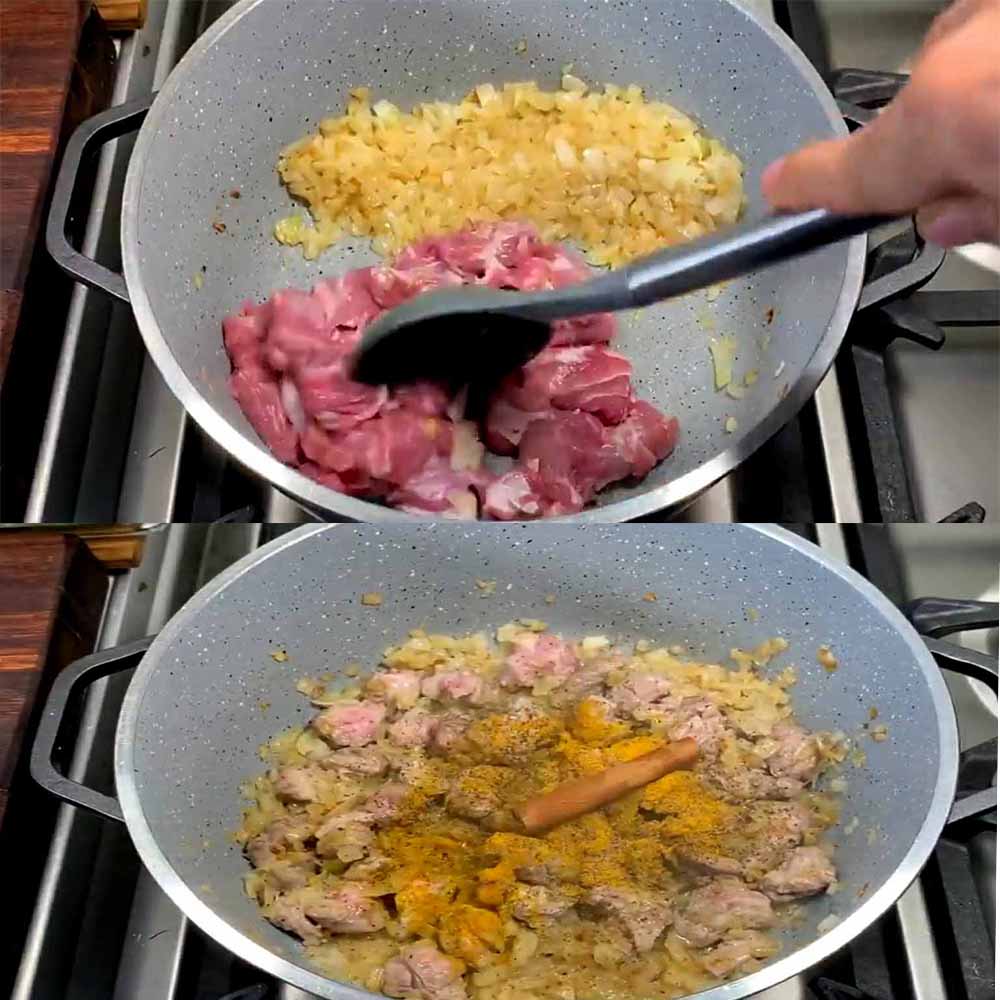 Adding cubed lamb meat to fried onions and turmeric in the pot