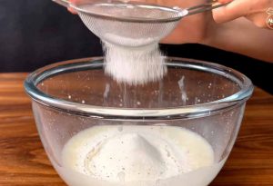 adding flour to rosette sweet