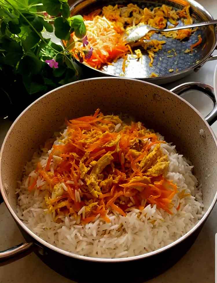pour some of the carrot and chicken mixture on the rice