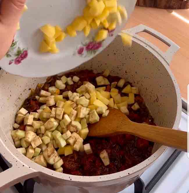 Add potatoes and eggplant to onions