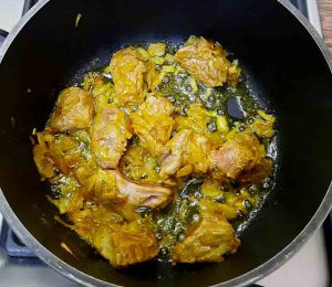 Fry onions and meat for khorak