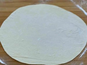 Then open the dough with a rolling pin